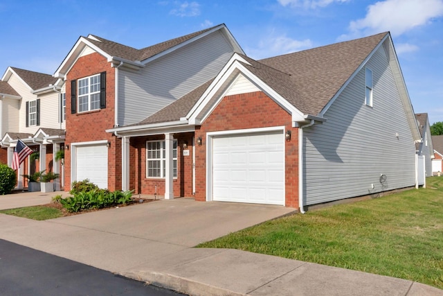 view of front facade featuring an attached garage, a shingled roof, brick siding, a front yard, and driveway
