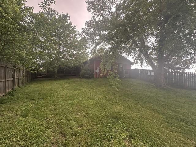view of yard with a fenced backyard