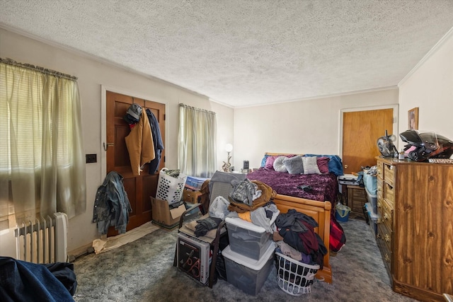 carpeted bedroom featuring crown molding, a textured ceiling, and radiator