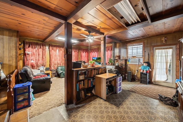 interior space featuring a ceiling fan, beam ceiling, wooden ceiling, wooden walls, and carpet flooring