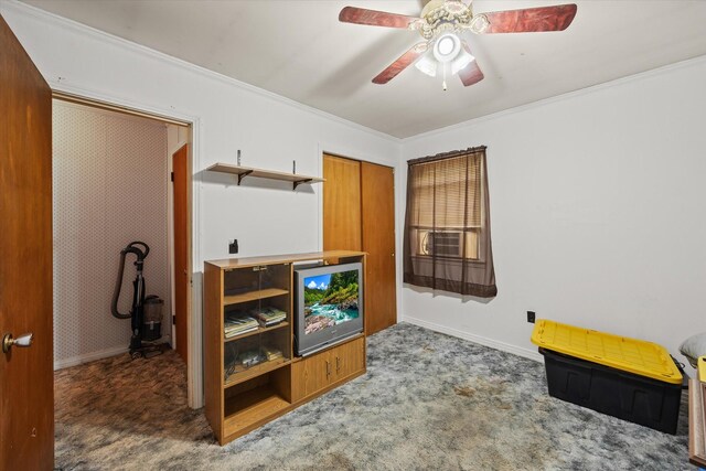 interior space with crown molding, a ceiling fan, and baseboards