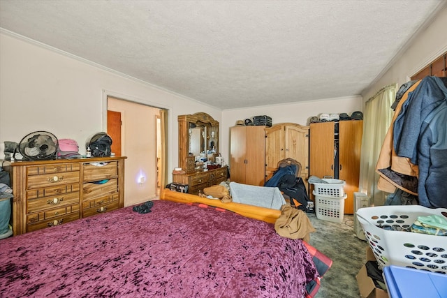carpeted bedroom featuring crown molding and a textured ceiling