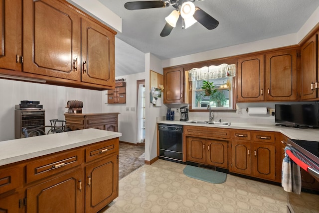 757 Acorn Dr, Clarksville, TN 37043 - kitchen with brown cabinetry, dishwasher, a sink, light countertops, and electric stove