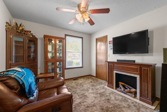 757 Acorn Dr, Clarksville, TN 37043 - carpeted living area with baseboards, a ceiling fan, a textured ceiling, and a premium fireplace