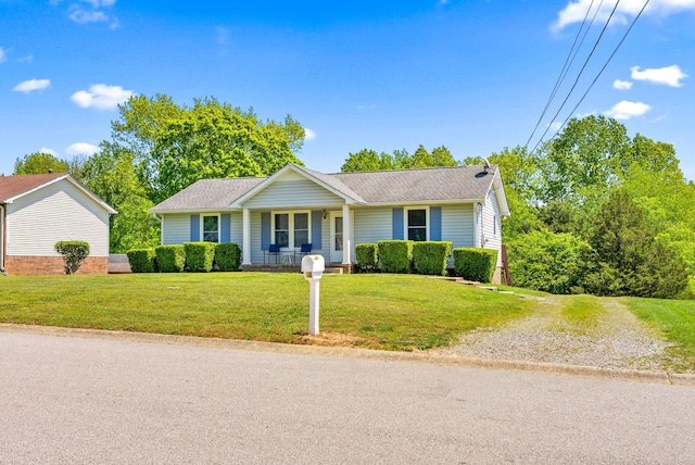 757 Acorn Dr, Clarksville, TN 37043 - ranch-style home with a porch, a shingled roof, and a front lawn
