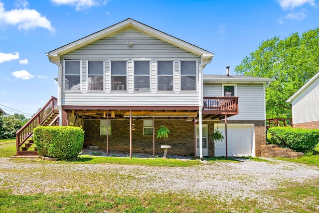 757 Acorn Dr, Clarksville, TN 37043 - view of front facade with stairway, brick siding, driveway, and a garage