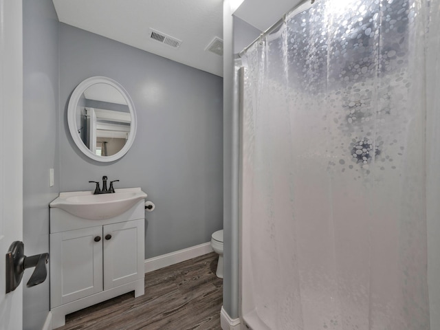 3120 Trenton Rd, Clarksville, TN 37040 - full bathroom with visible vents, wood finished floors, toilet, and vanity
