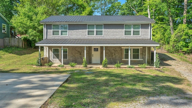 3120 Trenton Rd, Clarksville, TN 37040 - view of front of house with fence, covered porch, a front yard, and metal roof