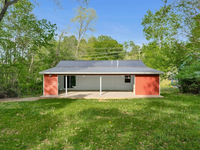 3120 Trenton Rd, Clarksville, TN 37040 - rear view of property featuring a patio, a yard, and metal roof