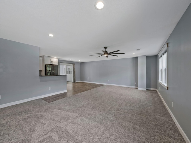 3120 Trenton Rd, Clarksville, TN 37040 - unfurnished living room featuring a ceiling fan, baseboards, recessed lighting, and dark carpet