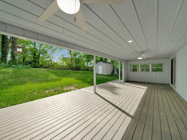 3120 Trenton Rd, Clarksville, TN 37040 - deck with a storage shed, a ceiling fan, an outdoor structure, and a lawn