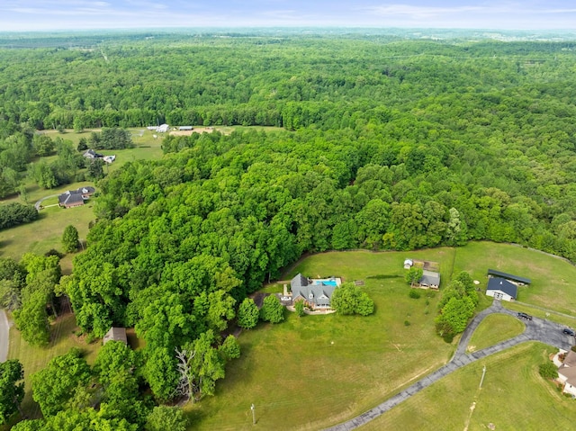 bird's eye view featuring a forest view