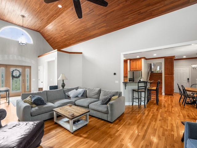 living room featuring light wood-style floors, ceiling fan with notable chandelier, high vaulted ceiling, and wooden ceiling