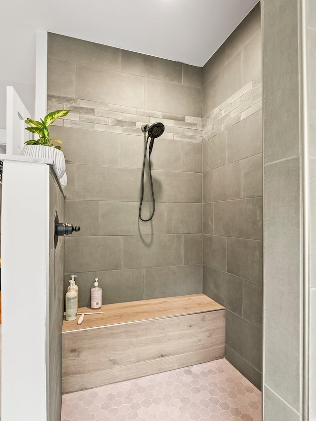 bathroom featuring tile patterned floors and tiled shower