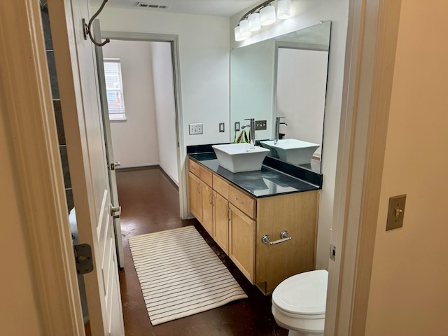 3000 Vanderbilt Pl Unit 118, Nashville, TN 37212 - bathroom with double vanity, a sink, visible vents, and toilet