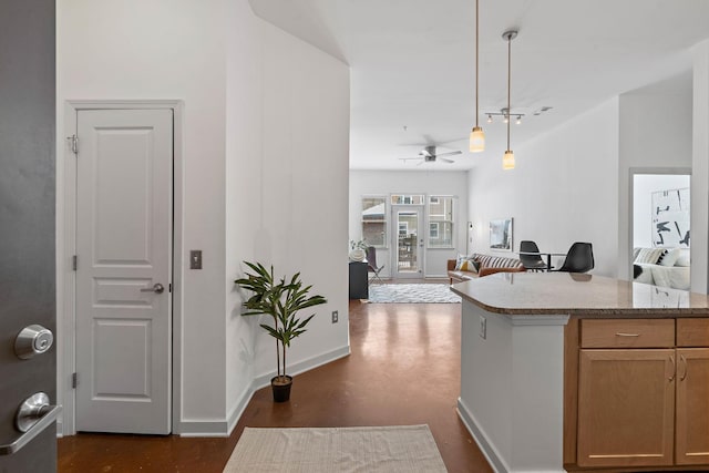 3000 Vanderbilt Pl Unit 118, Nashville, TN 37212 - kitchen with baseboards, ceiling fan, decorative light fixtures, and open floor plan