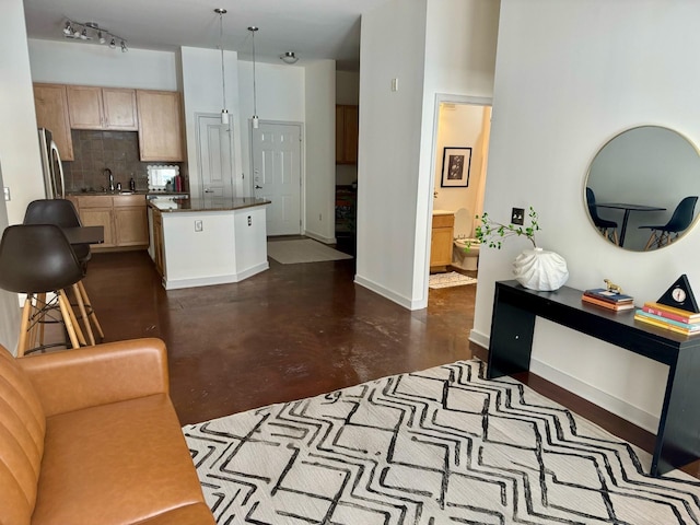 3000 Vanderbilt Pl Unit 118, Nashville, TN 37212 - living area featuring baseboards and finished concrete flooring