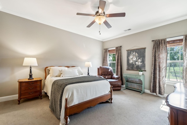 bedroom with crown molding, light carpet, and multiple windows