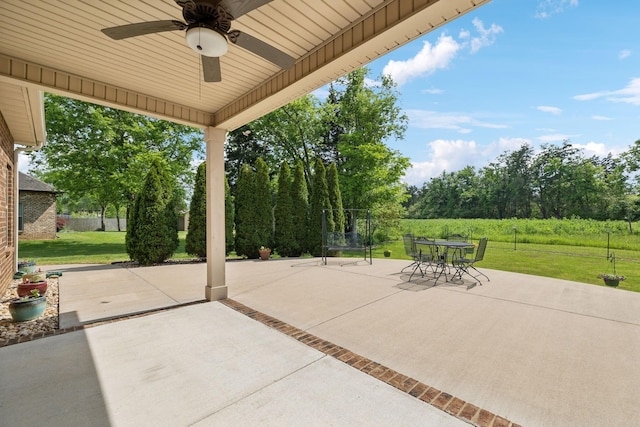 view of patio / terrace featuring outdoor dining area and ceiling fan
