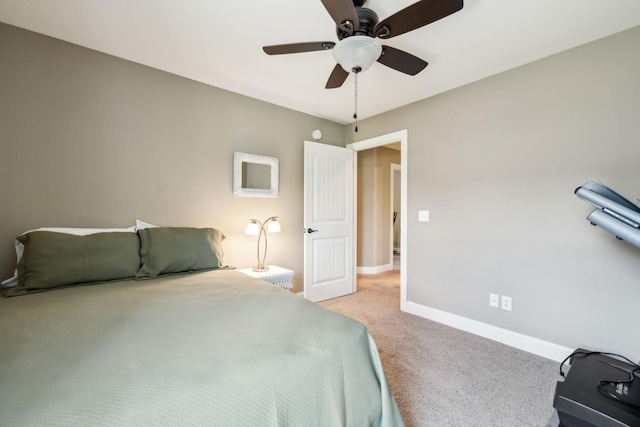 bedroom featuring a ceiling fan, baseboards, and light carpet