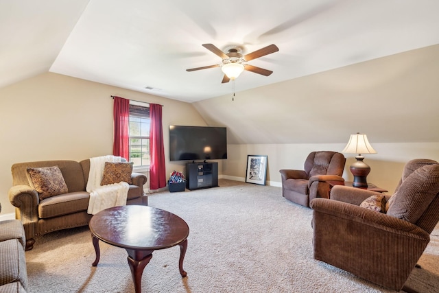carpeted living room featuring baseboards, a ceiling fan, vaulted ceiling, and visible vents