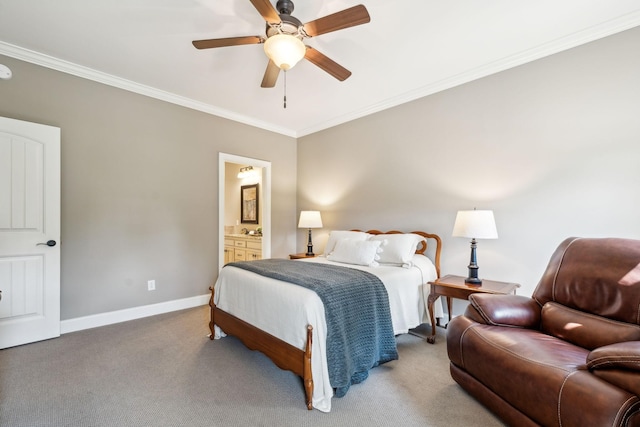 bedroom featuring crown molding, baseboards, carpet flooring, and ensuite bath