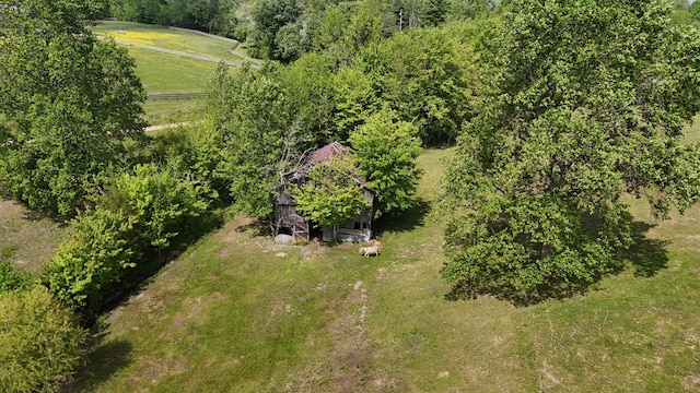 birds eye view of property with a rural view
