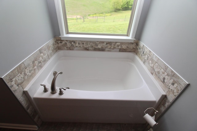 full bath with a garden tub