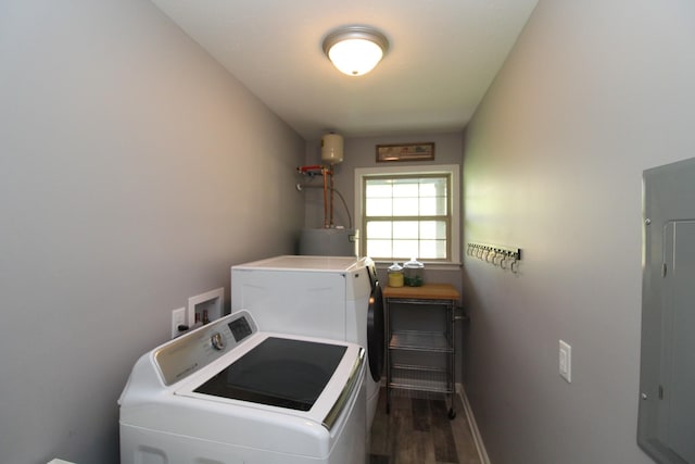 clothes washing area with laundry area, baseboards, dark wood-style floors, separate washer and dryer, and water heater