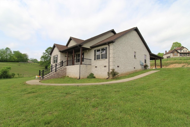 view of property exterior featuring a lawn, crawl space, brick siding, and a porch