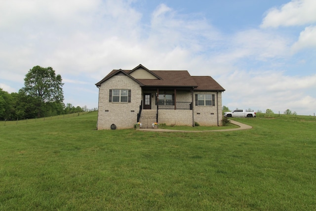 craftsman inspired home featuring brick siding, a front lawn, covered porch, and crawl space
