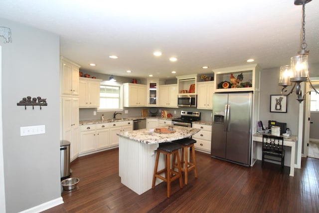 kitchen featuring open shelves, stainless steel appliances, dark wood-style floors, and a notable chandelier