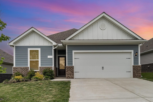 view of front facade featuring an attached garage, brick siding, board and batten siding, concrete driveway, and a lawn