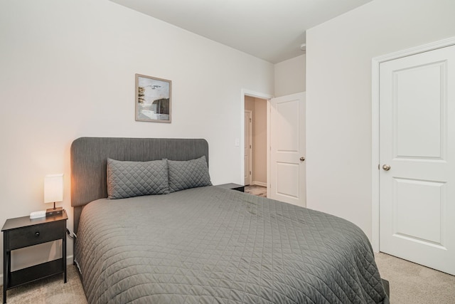 bedroom with light colored carpet