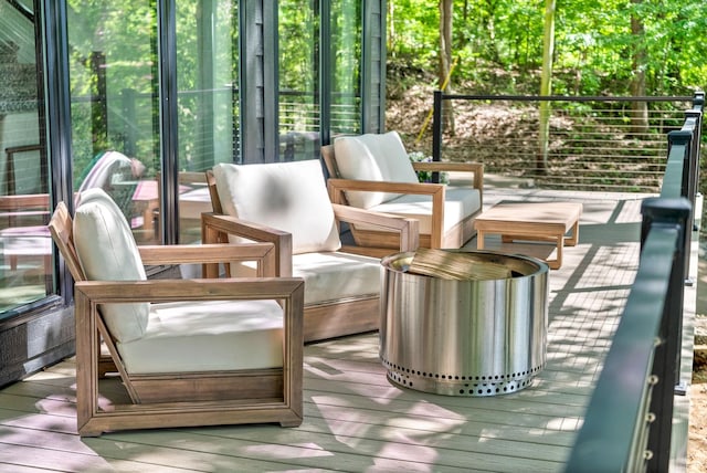 sunroom / solarium with hardwood / wood-style floors