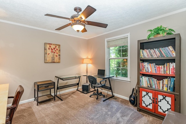 carpeted office featuring crown molding, baseboards, ceiling fan, and a textured ceiling