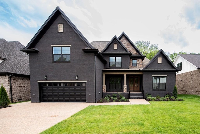 view of front of house with a garage, a front lawn, covered porch, brick siding, and driveway