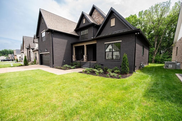 craftsman house with a porch, brick siding, driveway, and a front lawn