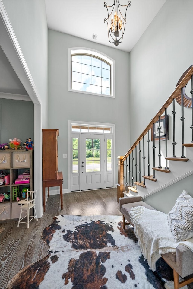 1005 Felts Dr, Clarksville, TN 37043 - foyer entrance with an inviting chandelier, plenty of natural light, a towering ceiling, and visible vents