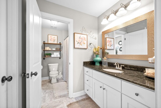 1005 Felts Dr, Clarksville, TN 37043 - full bathroom with vanity, baseboards, visible vents, and toilet