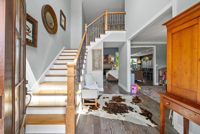 1005 Felts Dr, Clarksville, TN 37043 - entrance foyer with a high ceiling, a fireplace, baseboards, wood finished floors, and stairway