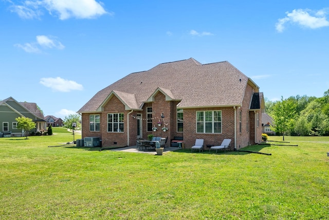 1005 Felts Dr, Clarksville, TN 37043 - rear view of property with central air condition unit, brick siding, and a yard