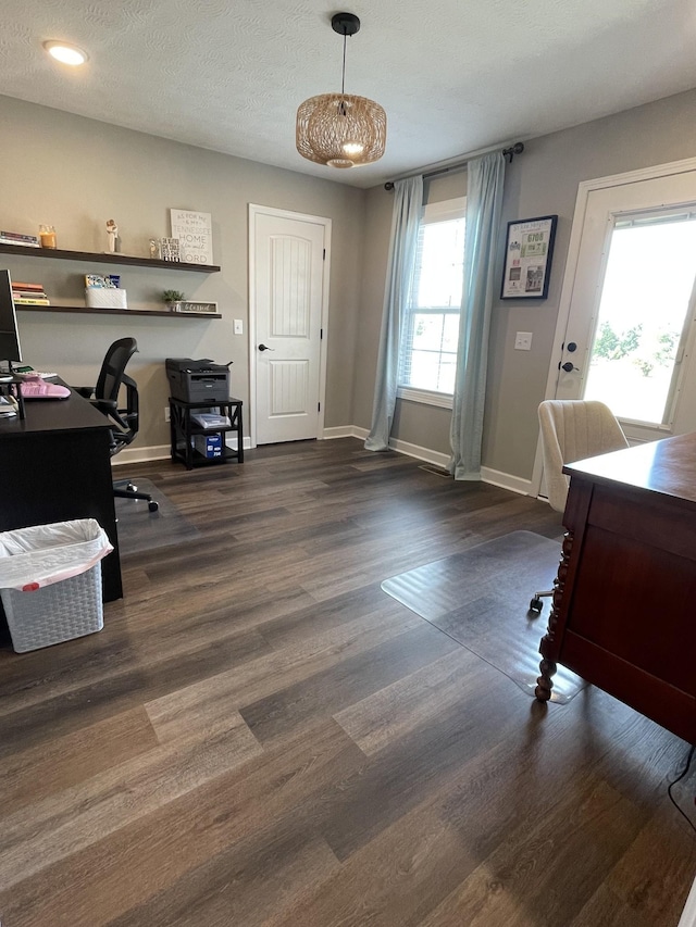 office area with baseboards and wood finished floors