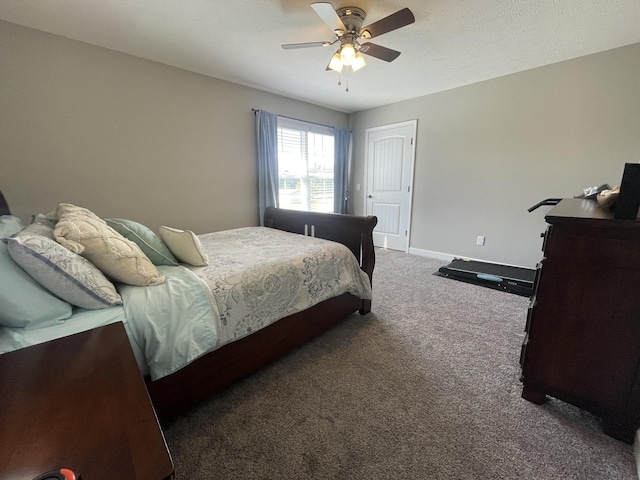 carpeted bedroom featuring ceiling fan and baseboards