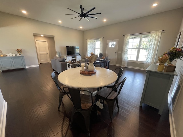 dining room with dark wood-type flooring, recessed lighting, baseboards, and ceiling fan