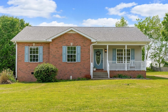 view of front of house featuring a porch, brick siding, roof with shingles, and a front lawn