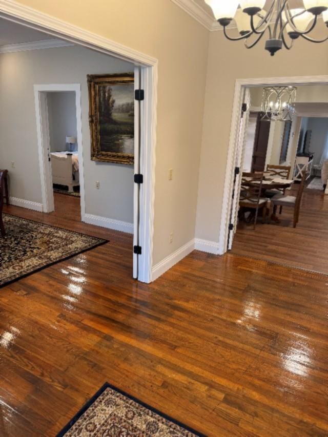 500 Brown St, Celina, TN 38551 - dining space with a chandelier, crown molding, hardwood / wood-style flooring, and baseboards