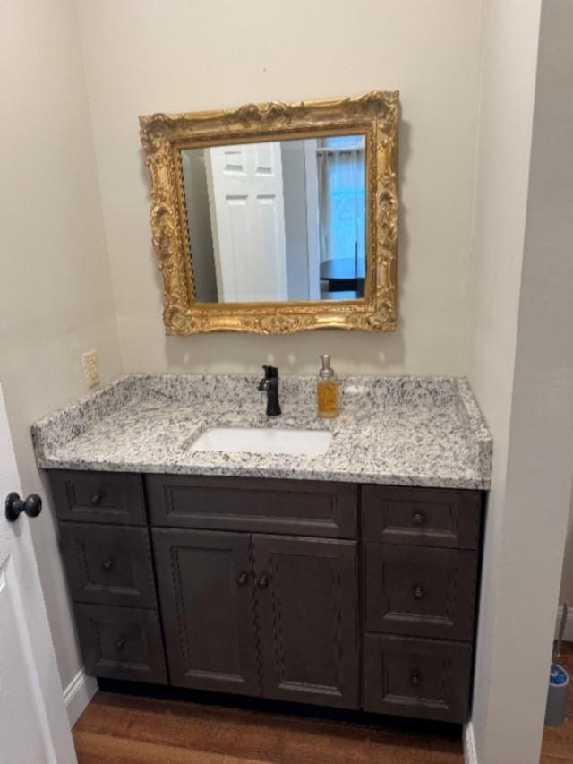 500 Brown St, Celina, TN 38551 - bathroom featuring wood finished floors, vanity, and baseboards