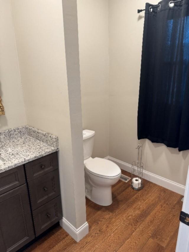 500 Brown St, Celina, TN 38551 - bathroom featuring wood finished floors, vanity, toilet, and baseboards