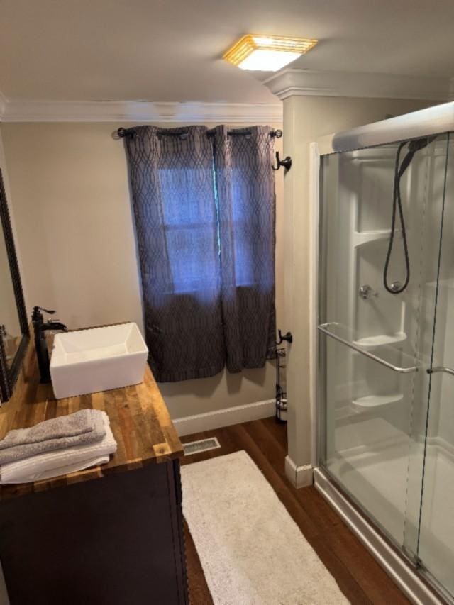 500 Brown St, Celina, TN 38551 - full bath with ornamental molding, wood finished floors, a stall shower, vanity, and baseboards